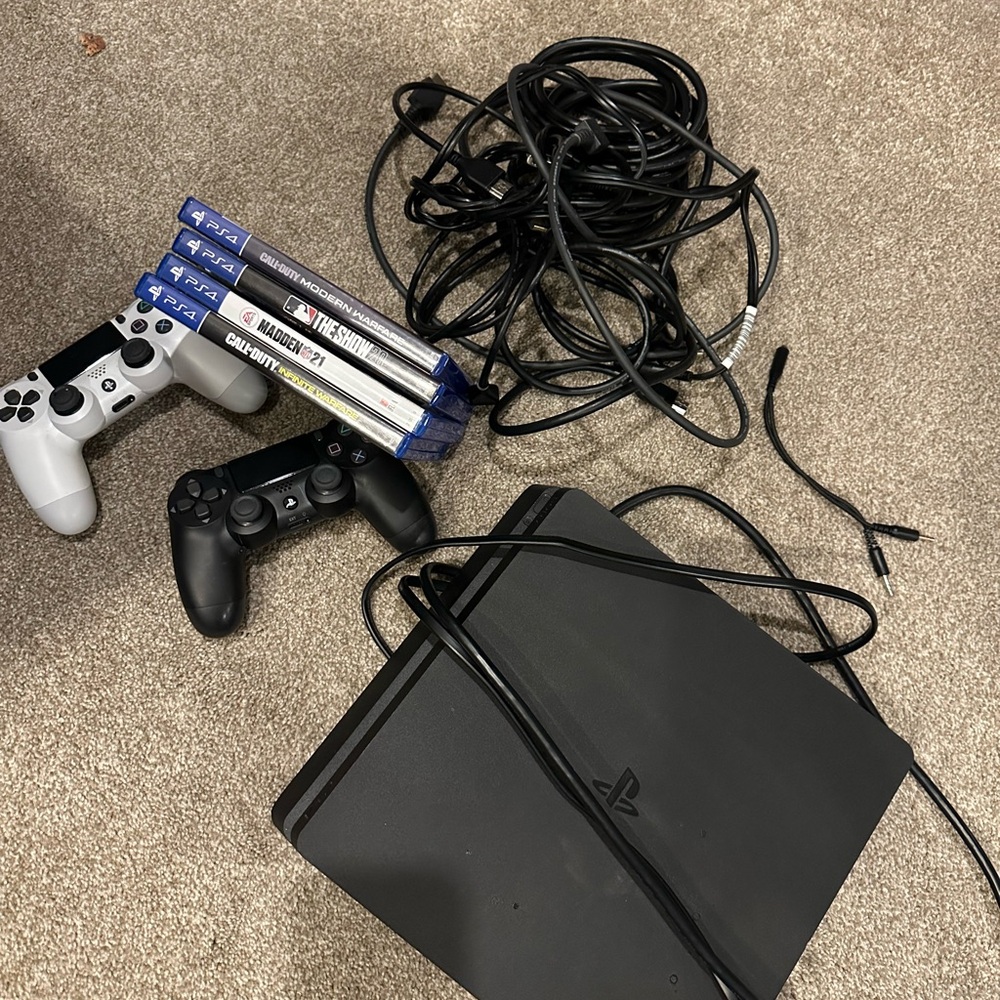 Sony PlayStation 4 Console with Black and White Controllers